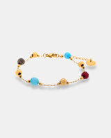 Pulsera en acero dorado con piedras multicolor.